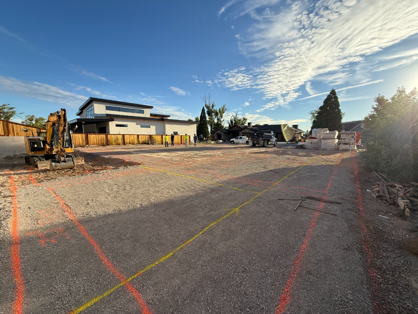 Structural pad graded and compacted, layout staked across the site