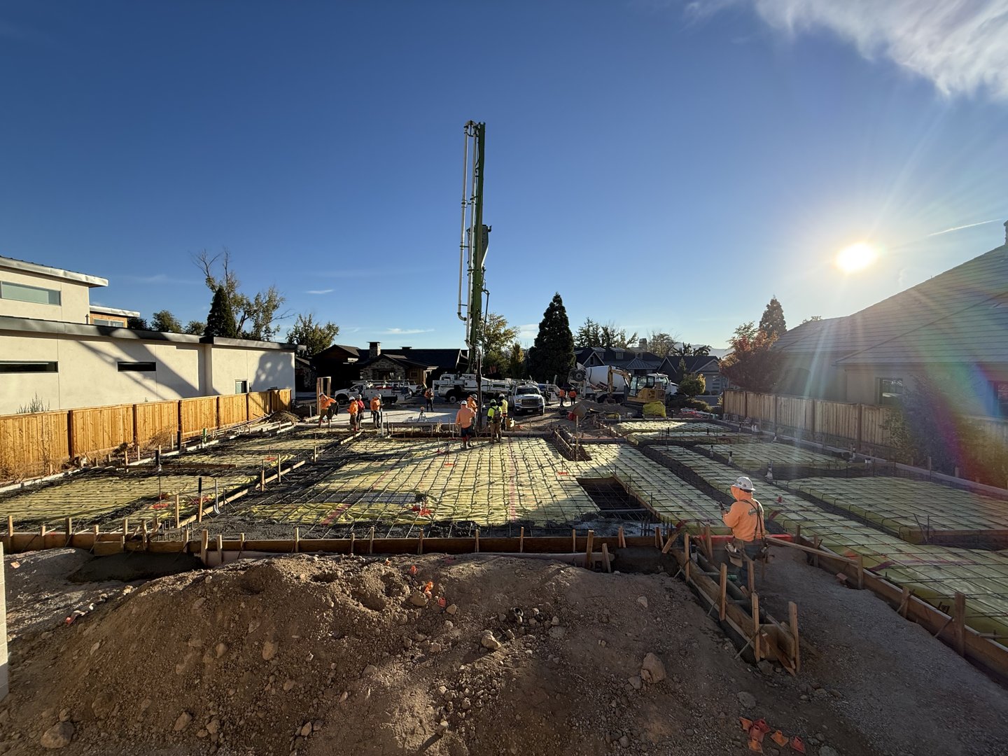 Rebar and wire mesh set across the pad ahead of slab placement