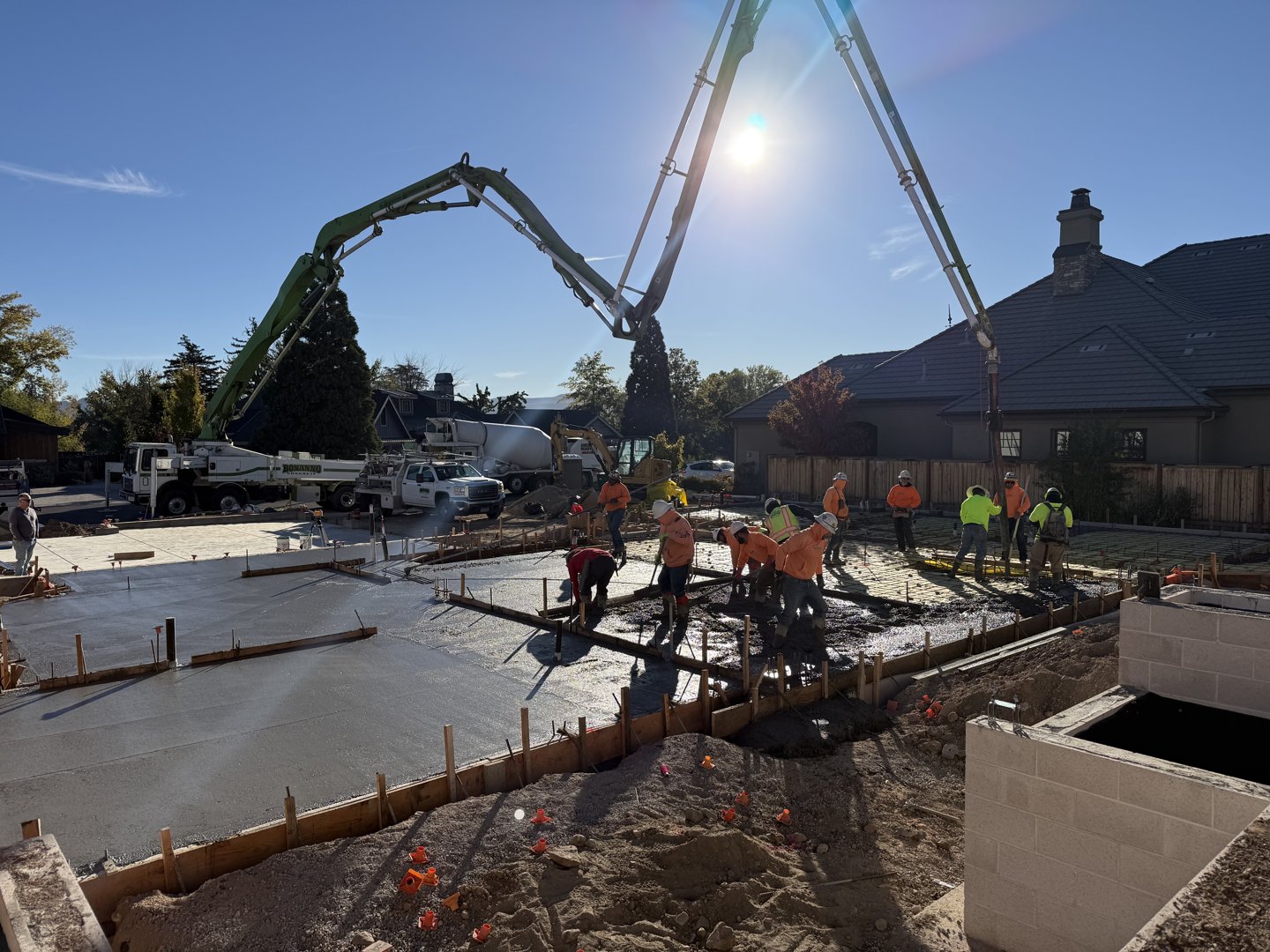 Slab placement underway along the forms and stem walls