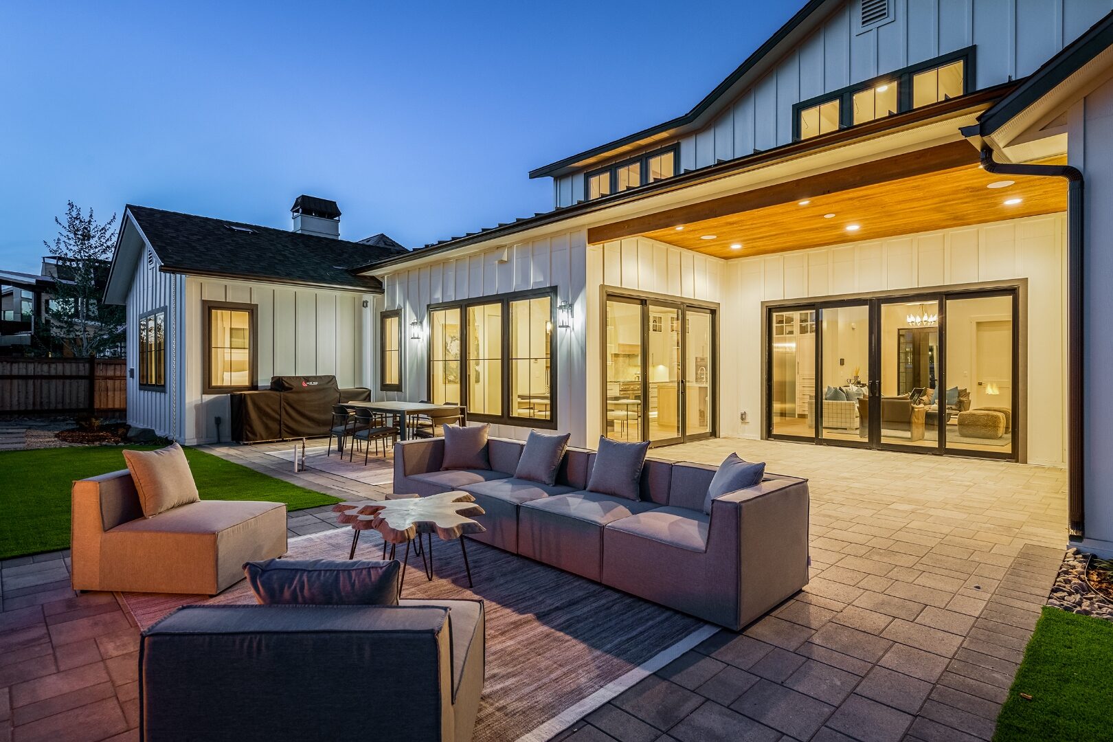 Modern farmhouse courtyard at dusk