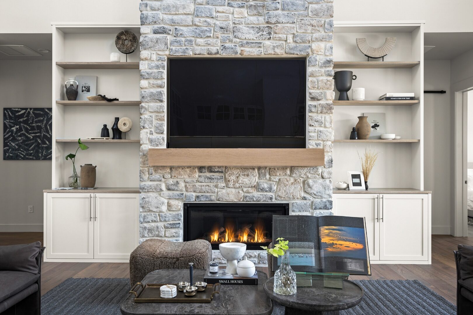 Stone fireplace with oak floating mantel