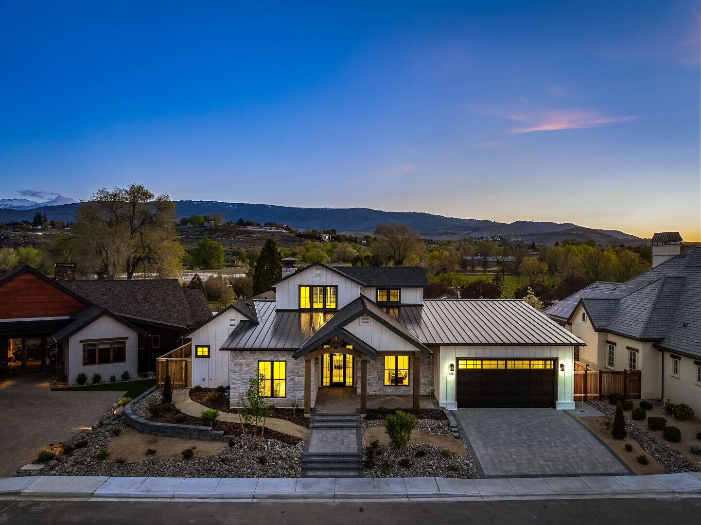 Triple Crown Residence exterior at dusk