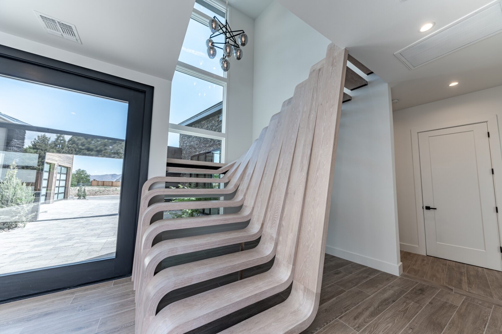 Sculptural pale-oak staircase