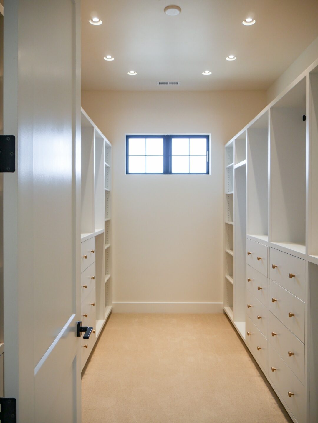 Walk-in closet with custom cabinetry