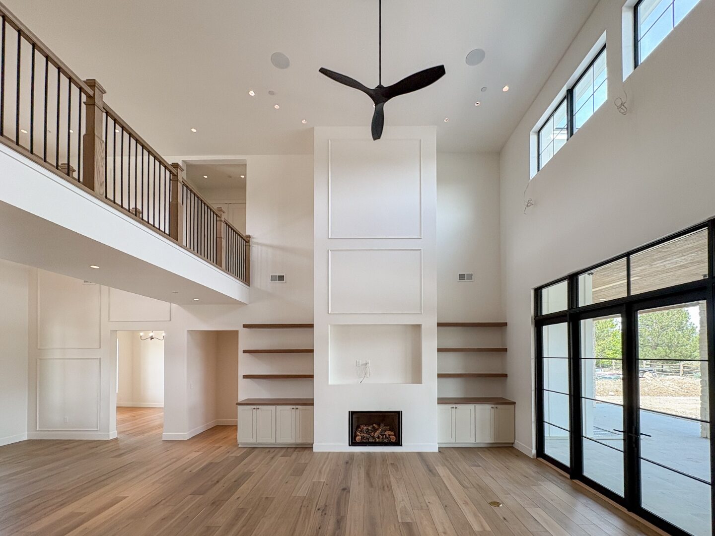 Great room built-ins and windows to the yard
