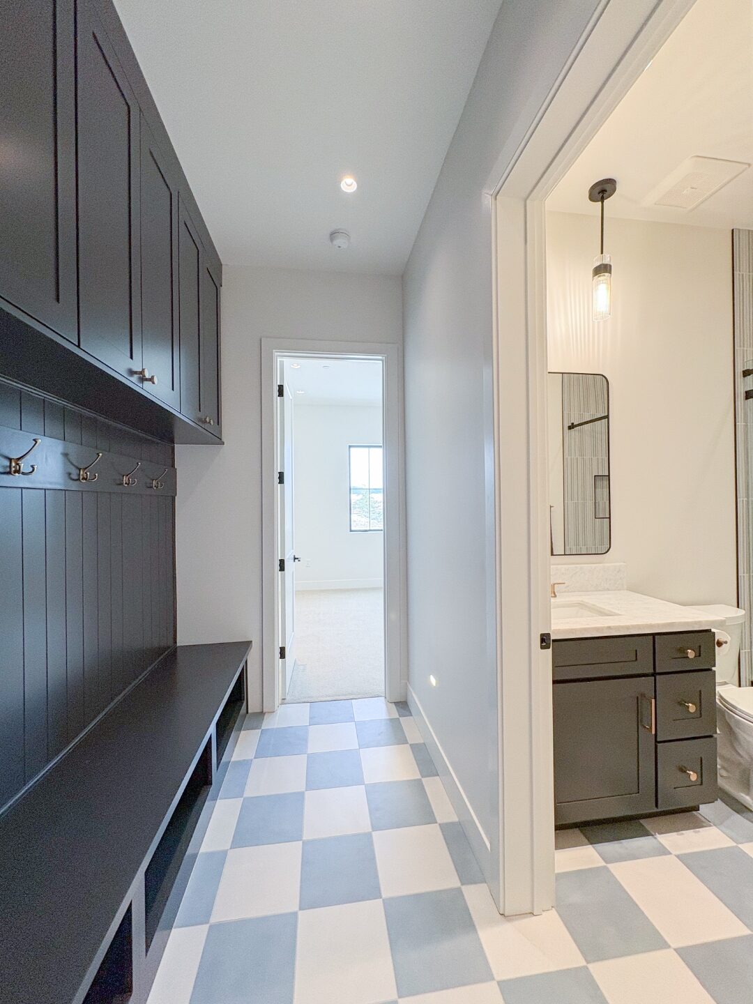 Hallway with checkerboard tile floor