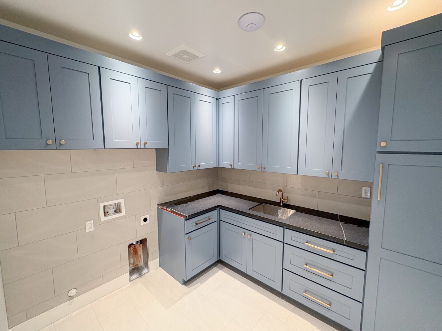 Laundry room with custom cabinetry