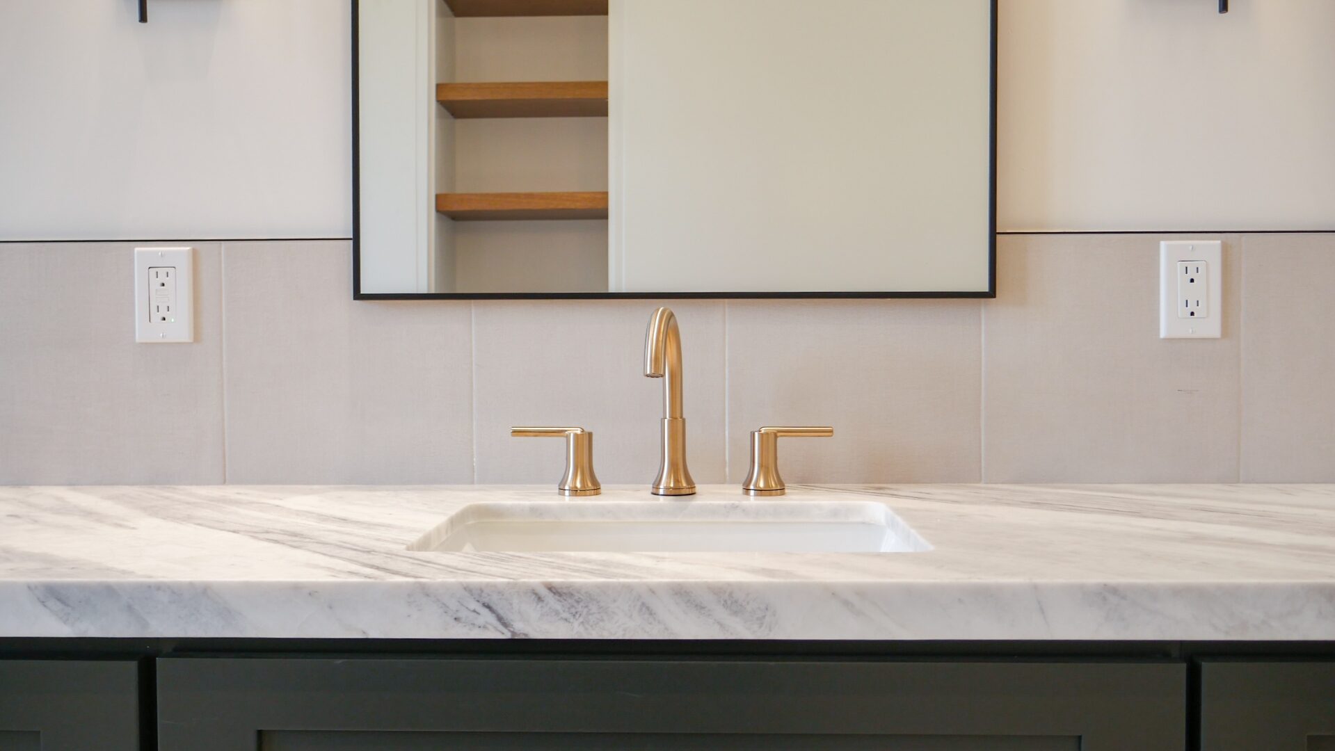 Primary bath double vanity with marble and brass