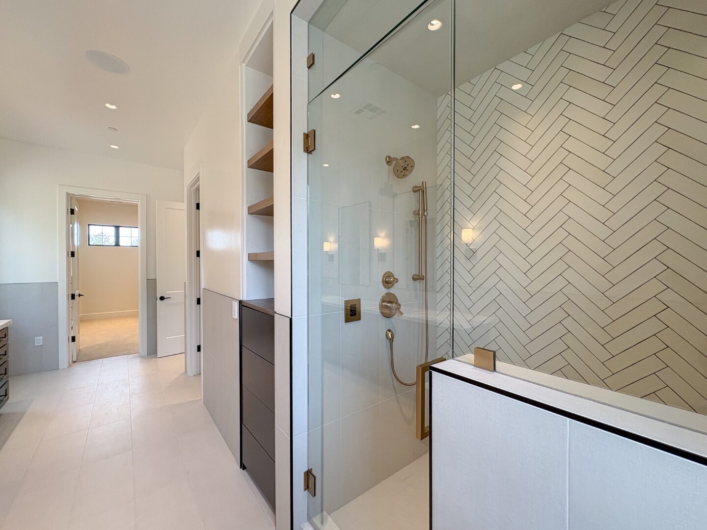 Primary shower with herringbone tile