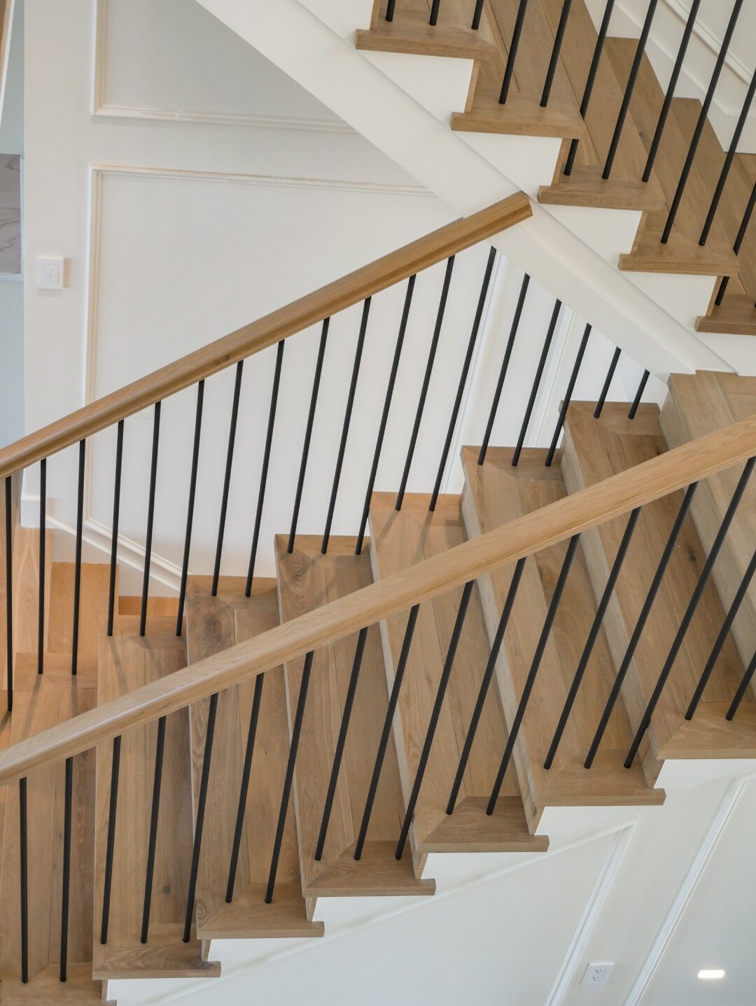 Stair detail with steel spindles and wood treads